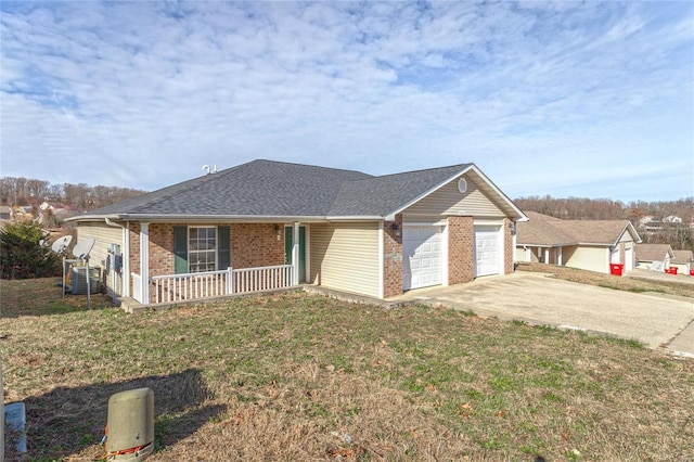 21011 Homer Rd Unit A & B, Saint Robert, MO 65584 - single story home with a porch, an attached garage, driveway, brick siding, and a front lawn