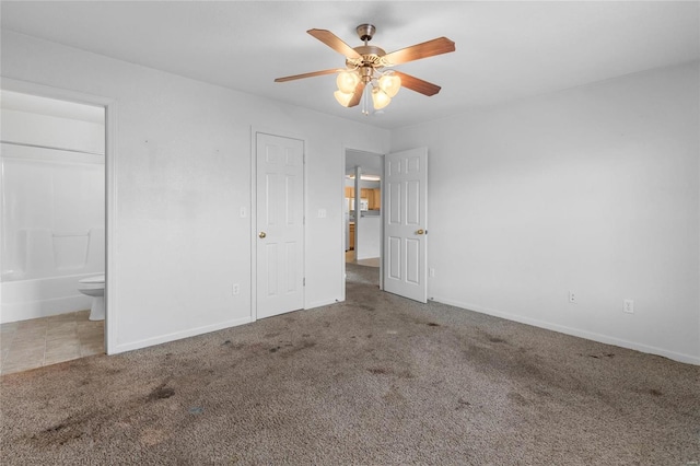 21011 Homer Rd Unit A & B, Saint Robert, MO 65584 - unfurnished bedroom featuring baseboards, carpet flooring, ensuite bath, and a ceiling fan