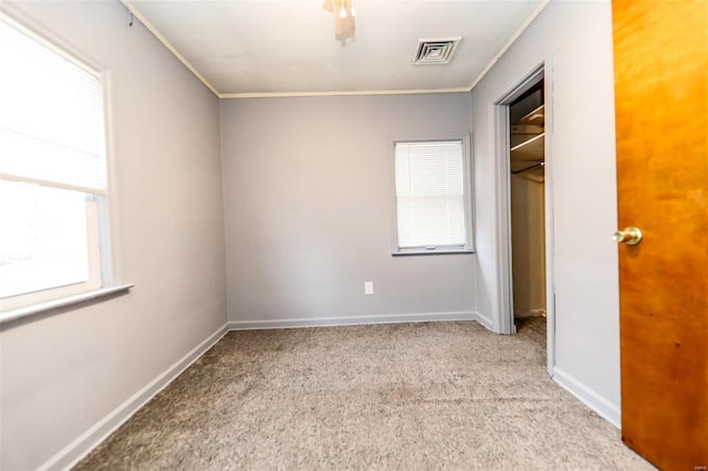 712 Greenwood Pl, Collinsville, IL 62234 - unfurnished bedroom with carpet, ornamental molding, baseboards, and a closet