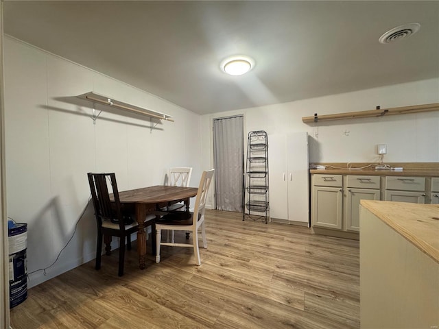 dining space with light wood-type flooring