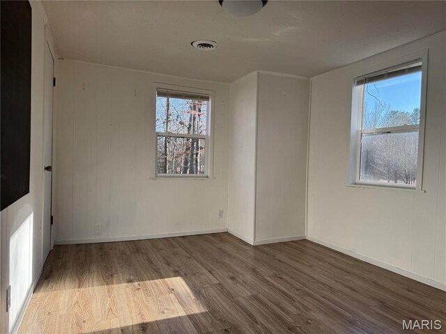 839 Bluebird Ln, Doniphan, MO 63935 - spare room with wood finished floors, healthy amount of natural light, and baseboards