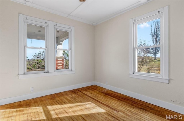 12449 Quarry Town Rd, Saint Genevieve, MO 63670 - spare room featuring healthy amount of natural light, baseboards, and wood finished floors