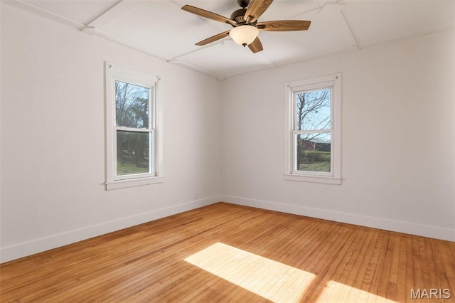 12449 Quarry Town Rd, Saint Genevieve, MO 63670 - unfurnished room with baseboards, light wood-style floors, and ceiling fan