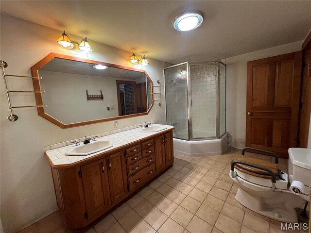 315 E Madison St, Paris, MO 65275 - full bathroom with tile patterned flooring, a stall shower, toilet, and double vanity