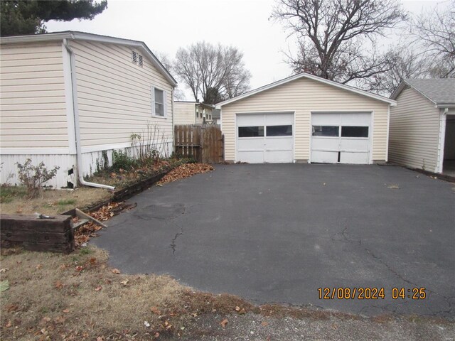 detached garage with fence