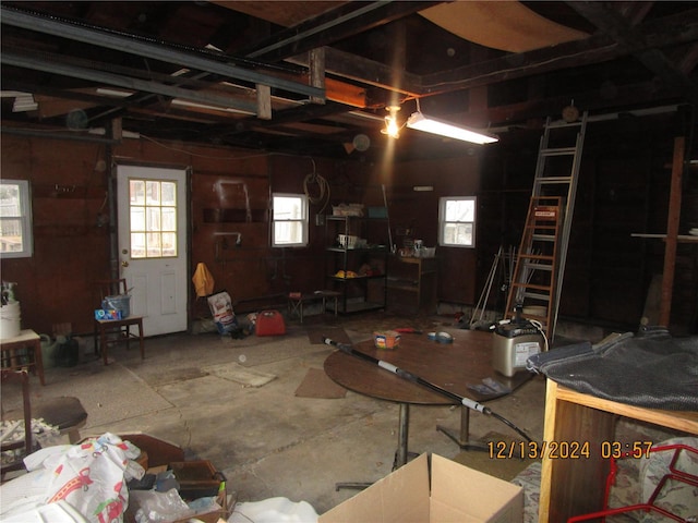 garage featuring wood walls