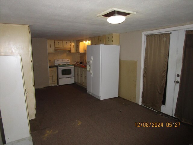 kitchen featuring white appliances and under cabinet range hood