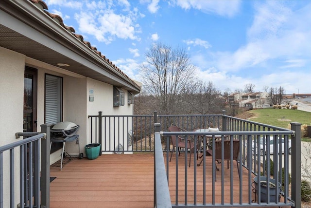 deck with outdoor dining area