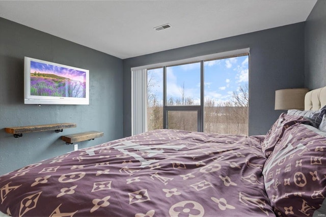 bedroom featuring a textured wall