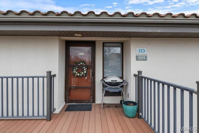 429 Racquet Club Dr Unit 3D-309, Village of Four Seasons, MO 65049 - doorway to property with stucco siding