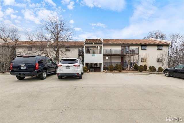 429 Racquet Club Dr Unit 3D-309, Village of Four Seasons, MO 65049 - view of building exterior with uncovered parking