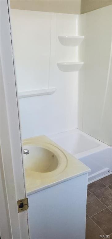 bathroom with vanity and  shower combination