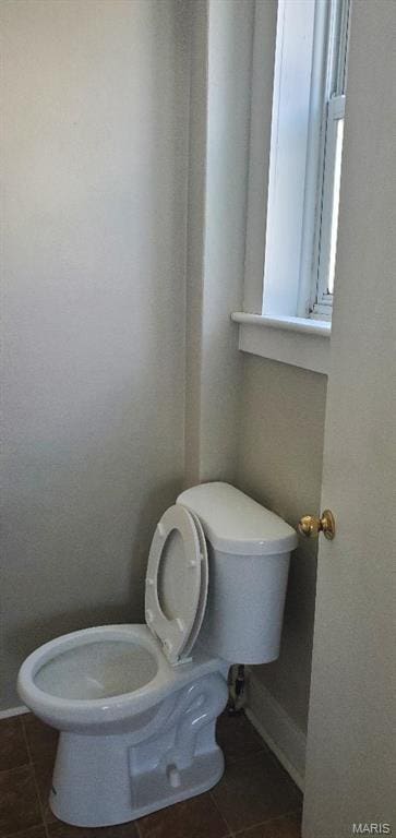 bathroom featuring tile patterned flooring and toilet