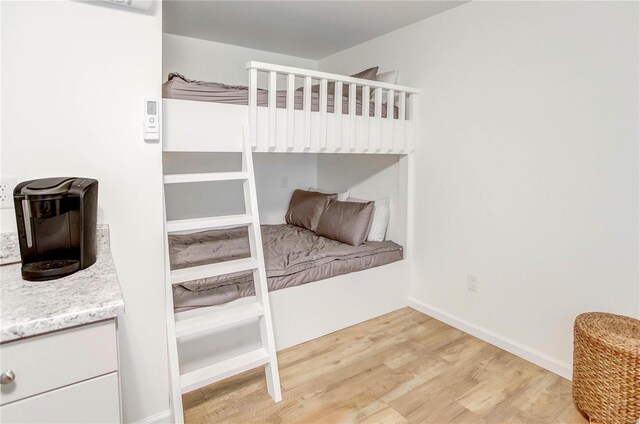 1100 W Main St, Grafton, IL 62037 - unfurnished bedroom featuring light wood-style floors