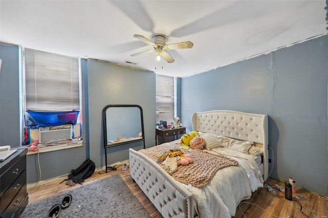 3833 Marine Ave, Saint Louis, MO 63118 - bedroom featuring wood finished floors, ceiling fan, and cooling unit
