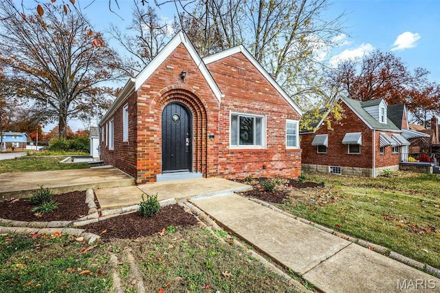 1021 Lakeview Ave, Saint Louis, MO 63138 - view of front of property with brick siding and a front yard