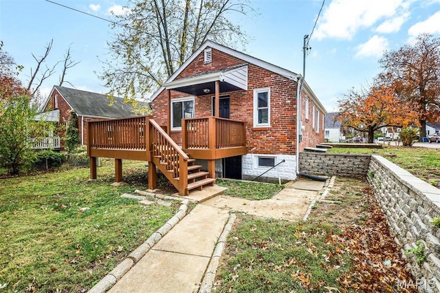 1021 Lakeview Ave, Saint Louis, MO 63138 - back of house with brick siding, a wooden deck, a lawn, and stairs