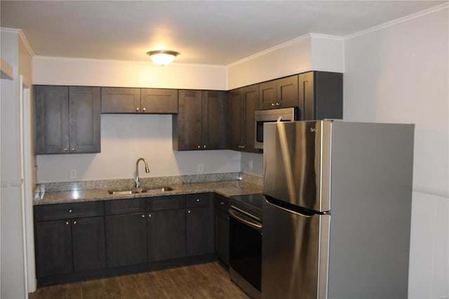 419 W Main St, Duquoin, IL 62832 - kitchen featuring freestanding refrigerator, electric stove, a sink, dark brown cabinetry, and light stone counters
