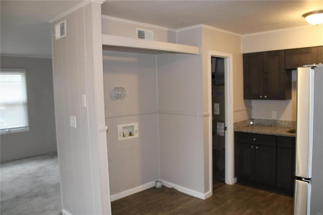 419 W Main St, Duquoin, IL 62832 - washroom with dark wood-style floors, washer hookup, crown molding, and baseboards