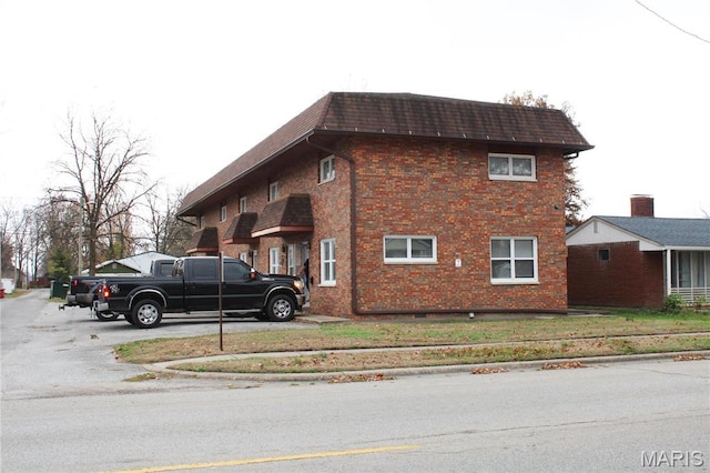 419 W Main St, Duquoin, IL 62832 - view of home's exterior featuring brick siding and mansard roof