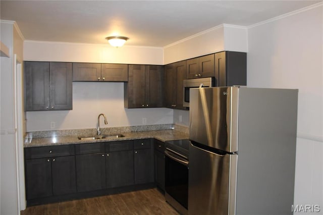419 W Main St, Duquoin, IL 62832 - kitchen featuring stainless steel appliances, dark brown cabinets, light stone countertops, dark wood finished floors, and ornamental molding