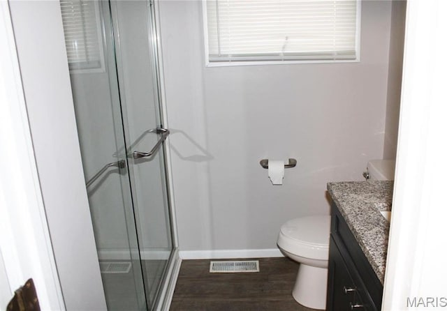 419 W Main St, Duquoin, IL 62832 - bathroom with vanity, a stall shower, and wood finished floors