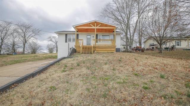 404 Lueking Dr, De Soto, MO 63020 - view of front facade with fence and a porch