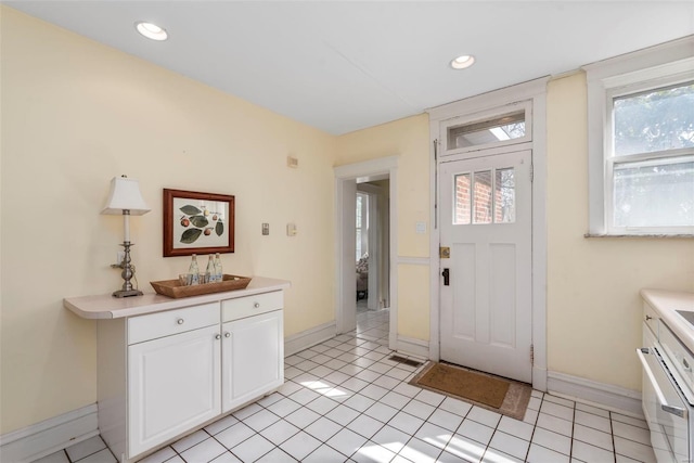 6954 Kingsbury Blvd, University City, MO 63130 - foyer entrance featuring baseboards and recessed lighting