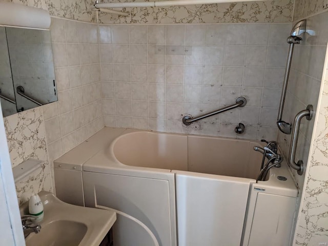 full bathroom featuring a tub, tile walls, and a shower