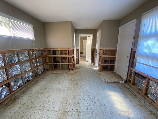 unfurnished room with healthy amount of natural light