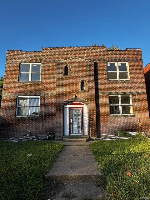 view of front of house with brick siding