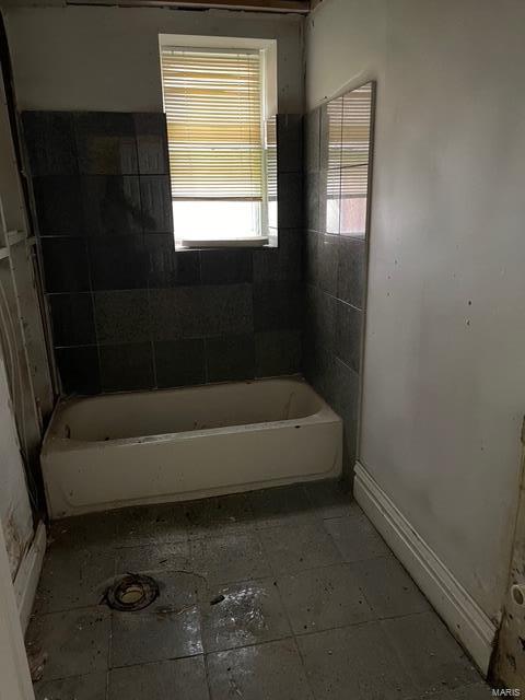 full bathroom with a tub