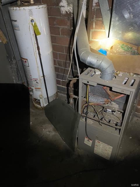 utility room with water heater