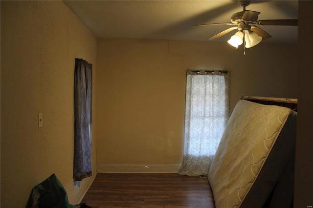 842 Kinzer St, Poplar Bluff, MO 63901 - unfurnished bedroom featuring wood finished floors, baseboards, and ceiling fan