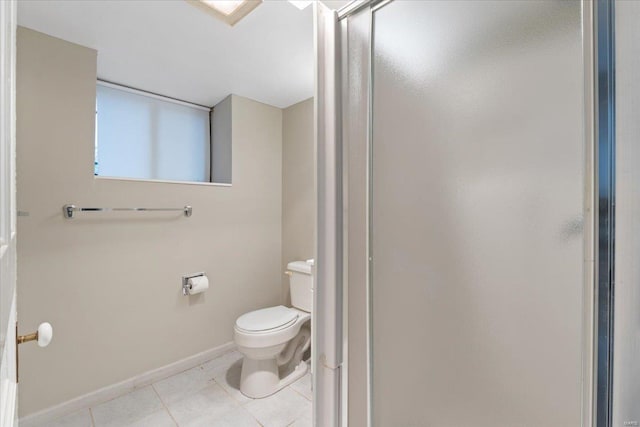 4361 Laclede Ave, Saint Louis, MO 63108 - bathroom featuring tile patterned flooring, a stall shower, toilet, and baseboards