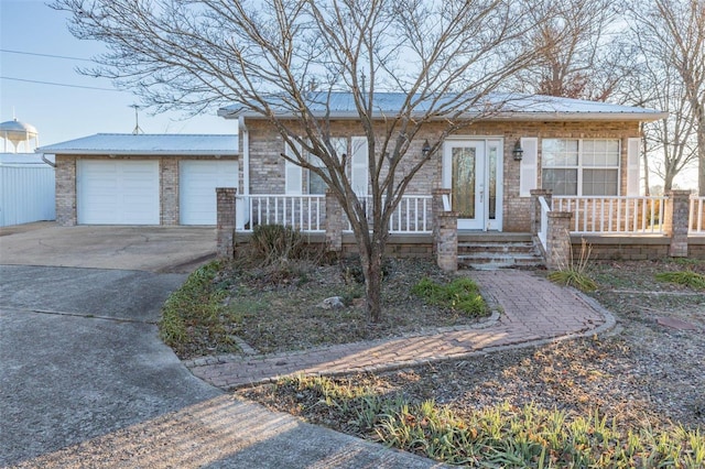 1728 Hitching Post Ln, Farmington, MO 63640 - ranch-style home with a porch, metal roof, and driveway
