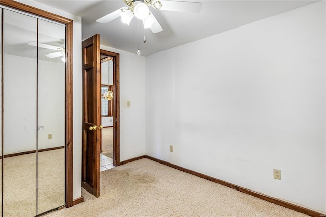 1728 Hitching Post Ln, Farmington, MO 63640 - unfurnished bedroom with light carpet, a closet, ceiling fan, and baseboards