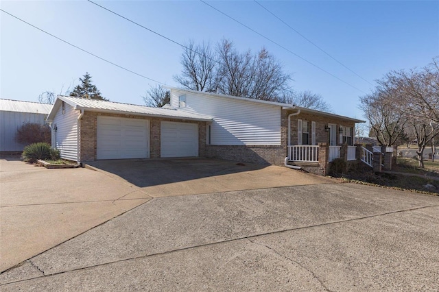1728 Hitching Post Ln, Farmington, MO 63640 - view of front of property with brick siding, driveway, and an attached garage