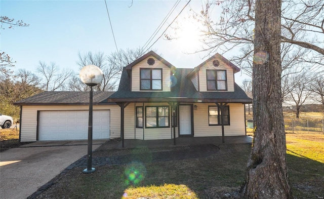 view of front facade with a garage, driveway, and covered porch