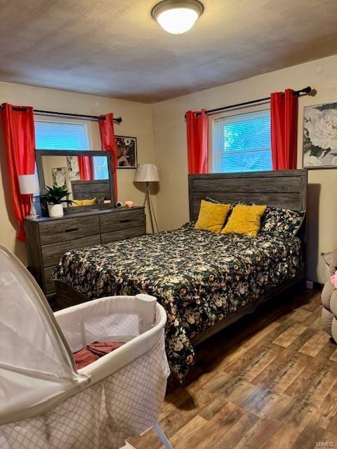 bedroom featuring wood finished floors
