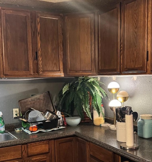 kitchen with dark countertops and decorative backsplash