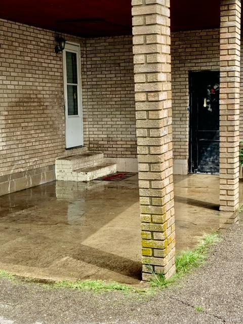exterior view of entry steps and brick siding