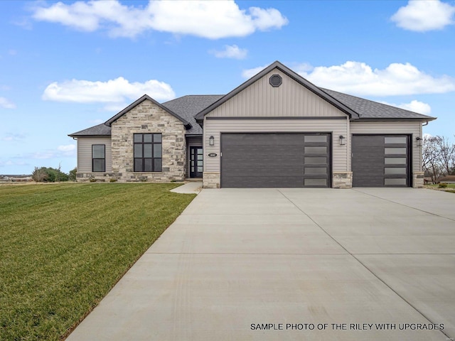 428 Hayden Dr, Waterloo, IL 62298 - view of front of property with stone siding, an attached garage, driveway, and a front lawn
