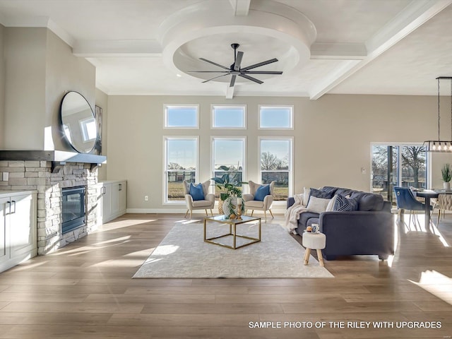 428 Hayden Dr, Waterloo, IL 62298 - living area with a ceiling fan, crown molding, a stone fireplace, wood finished floors, and beamed ceiling