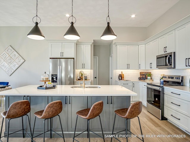 428 Hayden Dr, Waterloo, IL 62298 - kitchen featuring stainless steel appliances, a sink, white cabinetry, backsplash, and recessed lighting