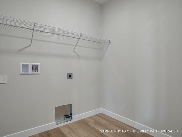 428 Hayden Dr, Waterloo, IL 62298 - clothes washing area with electric dryer hookup, light wood-style floors, baseboards, and washer hookup