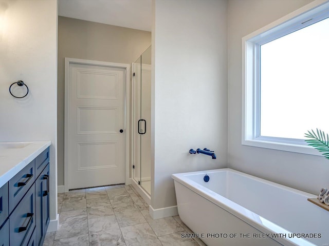 428 Hayden Dr, Waterloo, IL 62298 - full bathroom featuring marble finish floors, baseboards, a bathtub, a shower stall, and vanity
