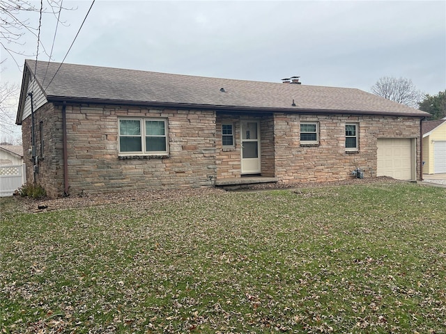 view of front of home featuring a shingled roof, stone siding, a garage, and a front lawn