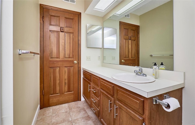 bathroom featuring vanity and baseboards
