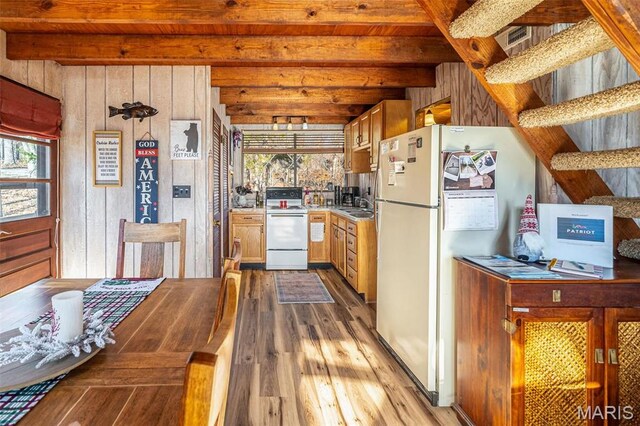 451 Foxfire Point Dr, Wright City, MO 63390 - kitchen with white appliances, beamed ceiling, wood finished floors, healthy amount of natural light, and wooden walls
